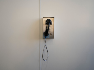 Wall home phone with black receiver and metal phone