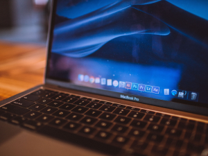 open laptop on desk at the home screen