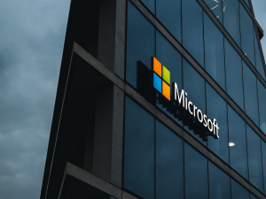 Glass office building with Microsoft logo on side of building managed services provider