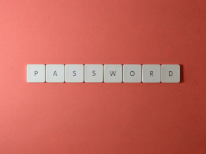 PASSWORD spelled out with Scrabble Tiles with a salmon background