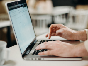 Person typing on a laptop